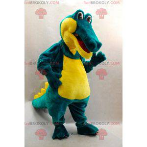 Mascote crocodilo verde e amarelo suave e divertido -