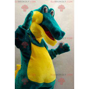 Mascote crocodilo verde e amarelo suave e divertido -