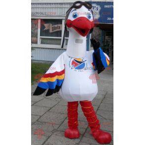 Mascotte de cigogne blanche avec des ailes multicolores -