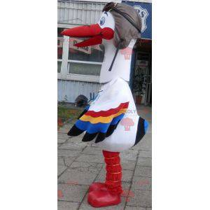 Mascotte de cigogne blanche avec des ailes multicolores -