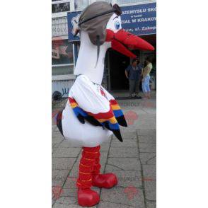 Mascotte de cigogne blanche avec des ailes multicolores -