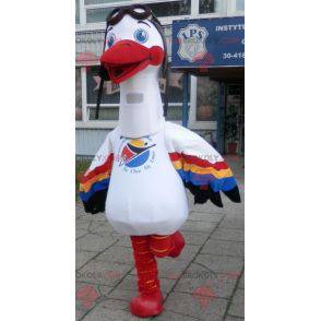 Mascotte de cigogne blanche avec des ailes multicolores -