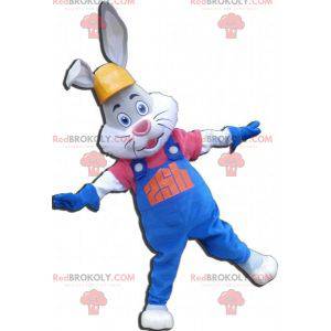 Gray and white rabbit mascot with overalls and headphones -