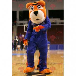 Orange and white tiger mascot in blue outfit - Redbrokoly.com