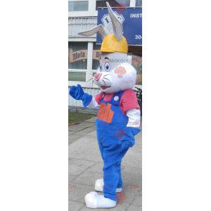 Gray and white rabbit mascot with overalls and headphones -