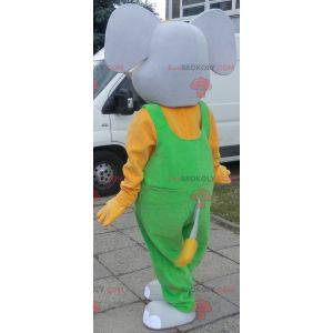 Mascotte elefante grigio e giallo vestito con una tuta -