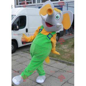 Mascote elefante cinza e amarelo vestido de macacão -
