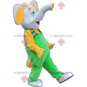 Mascote elefante cinza e amarelo vestido de macacão -