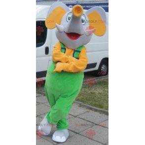 Mascote elefante cinza e amarelo vestido de macacão -