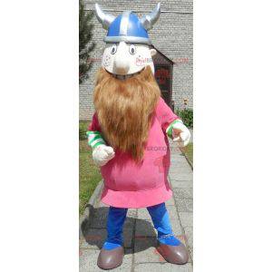 Mascote Viking barbudo vestido de rosa com um capacete -