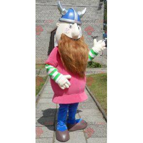 Mascota vikinga barbuda vestida de rosa con casco -