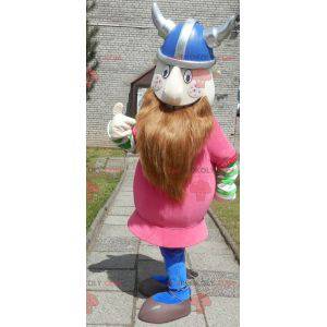 Mascote Viking barbudo vestido de rosa com um capacete -