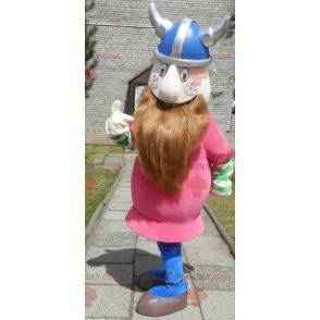 Mascote Viking barbudo vestido de rosa com um capacete -