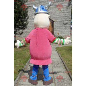 Mascota vikinga barbuda vestida de rosa con casco -