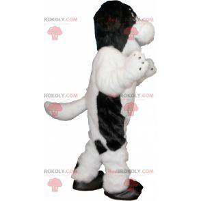 Haariges und süßes weißes und schwarzes Hundemaskottchen -