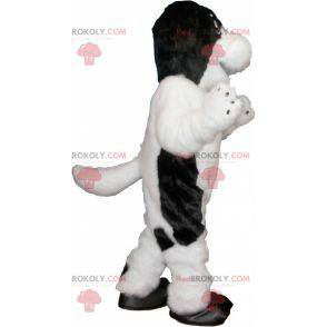 Mascote de cachorro branco e preto peludo e fofo -
