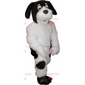 Mascote de cachorro branco e preto peludo e fofo -