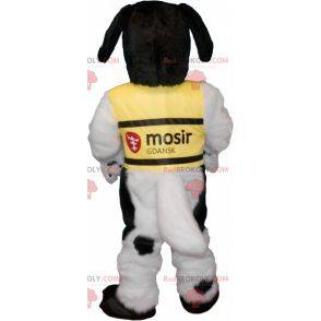 Mascote cachorro peludo preto e branco com colete amarelo -