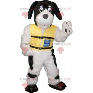 Black and white hairy dog mascot with a yellow vest -