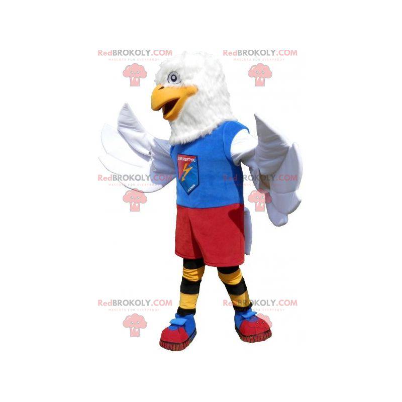 Mascota águila blanca en ropa deportiva colorida -