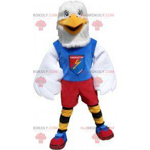 Mascota águila blanca en ropa deportiva colorida -