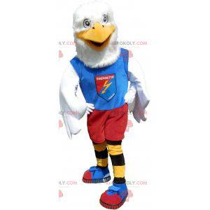 Mascota águila blanca en ropa deportiva colorida -