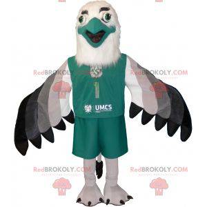 White and black gray vulture mascot dressed in green -