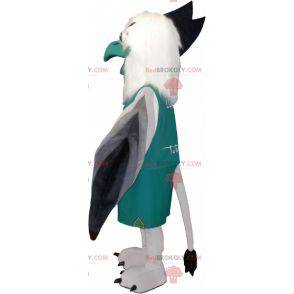 Mascotte avvoltoio grigio bianco e nero vestita di verde -