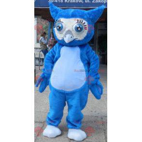 Mascota búho azul gigante con grandes ojos azules -