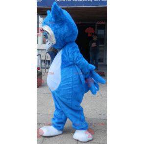 Giant blue owl mascot with big blue eyes - Redbrokoly.com
