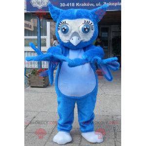 Mascota búho azul gigante con grandes ojos azules -