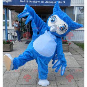 Mascote gigante coruja azul com grandes olhos azuis -