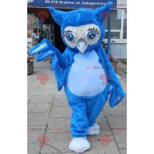 Mascote gigante coruja azul com grandes olhos azuis -