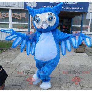 Mascote gigante coruja azul com grandes olhos azuis -