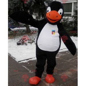 Mascota de pingüino negro, blanco y naranja. Disfraz de