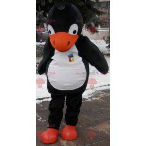 Mascotte de pingouin noir blanc et orange. Costume de pingouin