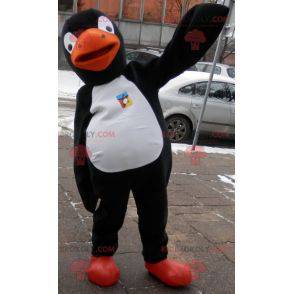 Mascota de pingüino negro, blanco y naranja. Disfraz de