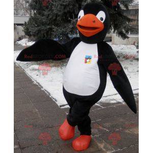 Pinguim mascote preto branco e laranja. Fantasia de pinguim -