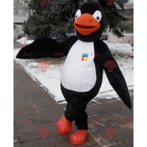 Pinguino mascotte nero bianco e arancione. Costume da pinguino