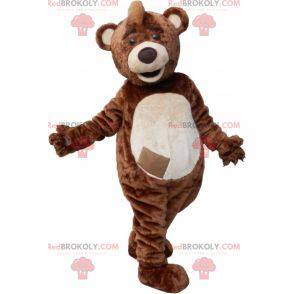 Brown and white teddy bear mascot with a crest - Redbrokoly.com