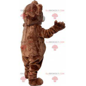 Brown and white teddy bear mascot with a crest - Redbrokoly.com