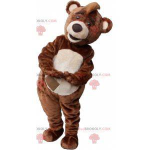 Brown and white teddy bear mascot with a crest - Redbrokoly.com