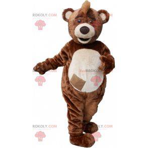 Brown and white teddy bear mascot with a crest - Redbrokoly.com