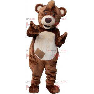 Brown and white teddy bear mascot with a crest - Redbrokoly.com