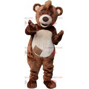 Mascota de oso de peluche marrón y blanco con una cresta -