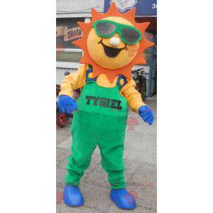 Mascote do sol vestido de macacão verde - Redbrokoly.com