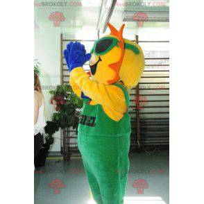 Mascote do sol vestido de macacão verde - Redbrokoly.com