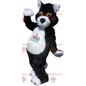 Schwarzweiss-Katzenmaskottchen mit orangefarbenen Augen -