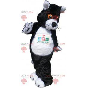 Schwarzweiss-Katzenmaskottchen mit orangefarbenen Augen -