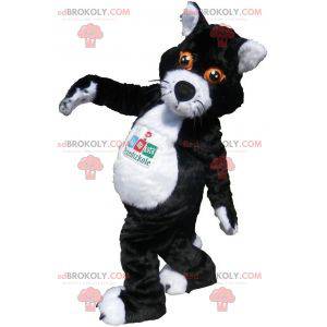 Svartvit kattmaskot med orange ögon - Redbrokoly.com